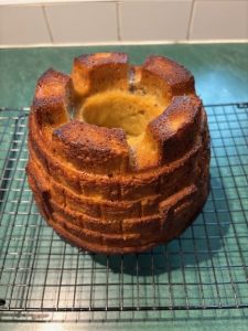 A freshly baked apple cake in the shape of a castle. 