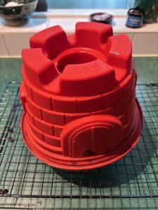 A silicone cake mould in the shape of a castle.