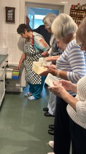 The group in the kitchen with Penny, handling the Lakeland tubs